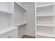 Well-organized walk-in closet with shelving, drawers, and hanging rods at 2114 Cowper Dr, Raleigh, NC 27608