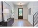 Bright foyer with hardwood floors, a decorative light fixture, and stylish accents at 2114 Cowper Dr, Raleigh, NC 27608