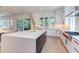 Stunning kitchen with a large island, stainless steel appliances, and seamless access to outdoor space at 2114 Cowper Dr, Raleigh, NC 27608