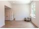 Minimalist living room with hardwood floors, a comfortable chair and a large window at 2114 Cowper Dr, Raleigh, NC 27608