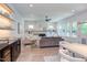 Open living room with hardwood floors, white walls, stylish furnishings, fireplace and built-ins, and an abundance of natural light at 2114 Cowper Dr, Raleigh, NC 27608