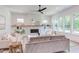 Inviting living room featuring a fireplace, built-in shelves, large windows, and comfortable seating for relaxation at 2114 Cowper Dr, Raleigh, NC 27608