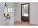 Bright office featuring hardwood floors, a large window, and a decorative glass paneled door at 2114 Cowper Dr, Raleigh, NC 27608