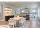 Inviting open concept living space with dining area, fireplace, and built-in shelving for seamless living at 2114 Cowper Dr, Raleigh, NC 27608