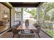 Covered patio with outdoor dining table and chairs, screened-in, overlooking backyard at 2114 Cowper Dr, Raleigh, NC 27608