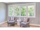Cozy sitting area with two upholstered chairs and lots of natural light at 2114 Cowper Dr, Raleigh, NC 27608