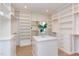 Large walk-in closet with custom shelving, drawers, and ample storage space at 2114 Cowper Dr, Raleigh, NC 27608