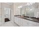 Spacious bathroom with double sinks, granite countertops, and a walk-in closet nearby at 217 Macy Grove Dr, Chapel Hill, NC 27517