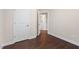 Bedroom with hardwood floors and a view into the ensuite bathroom at 217 Macy Grove Dr, Chapel Hill, NC 27517