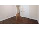 Comfortable bedroom with hardwood floors, neutral walls, and easy access to other rooms at 217 Macy Grove Dr, Chapel Hill, NC 27517
