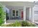 Inviting front porch with seating, offering a cozy spot to relax and enjoy the neighborhood views at 217 Macy Grove Dr, Chapel Hill, NC 27517