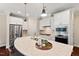 Modern kitchen boasts stainless steel appliances, quartz countertops, an island, and ample cabinet space at 217 Macy Grove Dr, Chapel Hill, NC 27517