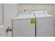 Functional laundry room with a modern washer and dryer for convenient chores at 217 Macy Grove Dr, Chapel Hill, NC 27517