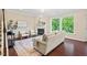 Inviting living room with a fireplace, plush seating, and abundant natural light, creating a cozy atmosphere at 217 Macy Grove Dr, Chapel Hill, NC 27517