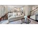Cozy living room featuring a comfortable sofa, stylish rug, and seamless flow to the kitchen and dining areas at 217 Macy Grove Dr, Chapel Hill, NC 27517