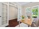 Bright office space with french doors, hardwood floors, and a large desk, ideal for a professional workspace at 217 Macy Grove Dr, Chapel Hill, NC 27517