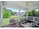 Screened porch with ceiling fan and outdoor seating overlooking the lawn at 217 Macy Grove Dr, Chapel Hill, NC 27517