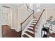A bright staircase with wooden rails and white risers leads to the upper level at 217 Macy Grove Dr, Chapel Hill, NC 27517