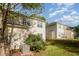 View of a backyard featuring an air conditioning unit, lush grass, and garden beds at 2261 Plum Frost Dr, Raleigh, NC 27603