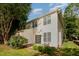 Backyard featuring lush greenery, an adjacent building, and patio access at 2261 Plum Frost Dr, Raleigh, NC 27603