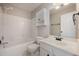 Bright bathroom with white vanity, cabinet, and tub-shower combination at 2261 Plum Frost Dr, Raleigh, NC 27603