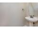 Powder room featuring a pedestal sink and neutral wall color at 2261 Plum Frost Dr, Raleigh, NC 27603