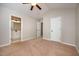 Bedroom with carpet, ceiling fan, and an ensuite bathroom at 2261 Plum Frost Dr, Raleigh, NC 27603