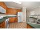 Functional kitchen featuring wooden cabinets, neutral countertops, and essential appliances at 2261 Plum Frost Dr, Raleigh, NC 27603