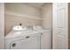 Laundry room featuring a Maytag washer and dryer with white wire shelving at 2261 Plum Frost Dr, Raleigh, NC 27603