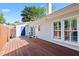 Spacious backyard featuring a wood deck, access to home, and fenced in area at 2617 Cottage Cir, Raleigh, NC 27613