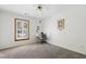 Carpeted bedroom with ceiling fan and large window for natural light at 2617 Cottage Cir, Raleigh, NC 27613