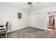 Carpeted bedroom with double closet and views to another room at 2617 Cottage Cir, Raleigh, NC 27613