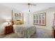 Cozy bedroom featuring a decorative bedspread, carpeted floors, and natural light at 2617 Cottage Cir, Raleigh, NC 27613