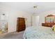 Bright bedroom with carpeted floors, wooden furniture, and ensuite bathroom at 2617 Cottage Cir, Raleigh, NC 27613