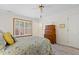 Bedroom featuring carpet, wood furnishings, and a window with shuttered blinds at 2617 Cottage Cir, Raleigh, NC 27613