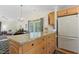 Kitchen with island, granite countertops, adjacent to the living space at 2617 Cottage Cir, Raleigh, NC 27613