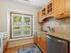Sunlit kitchen with granite countertops, stainless steel appliances, and a cozy window seat at 2617 Cottage Cir, Raleigh, NC 27613