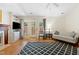 Bright living room with a ceiling fan, comfortable seating, and natural light at 2617 Cottage Cir, Raleigh, NC 27613
