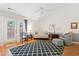 Inviting living room with vaulted ceilings, stylish furnishings, and French doors at 2617 Cottage Cir, Raleigh, NC 27613