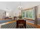 Spacious living and dining area featuring vaulted ceilings and a bay window at 2617 Cottage Cir, Raleigh, NC 27613
