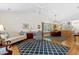 Open concept living and dining area with vaulted ceilings and natural light at 2617 Cottage Cir, Raleigh, NC 27613