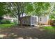 The backyard boasts a screened-in porch and mature trees offering a peaceful and private outdoor space at 2804 Barmettler St, Raleigh, NC 27607