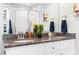 Bathroom featuring double vanity with granite countertop and glass shower at 2804 Barmettler St, Raleigh, NC 27607