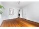 Bright bedroom featuring hardwood floors, neutral walls, and a ceiling fan at 2804 Barmettler St, Raleigh, NC 27607