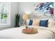 Bright bedroom features a tray on the bed with refreshments and decor at 2804 Barmettler St, Raleigh, NC 27607