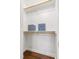 Bright closet with white shelves and wood floor at 2804 Barmettler St, Raleigh, NC 27607