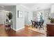 Bright dining room with hardwood floors and classic chandelier at 2804 Barmettler St, Raleigh, NC 27607