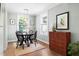 Charming dining room with ample natural light, updated fixtures, and seating for four at 2804 Barmettler St, Raleigh, NC 27607