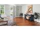 Welcoming entryway with hardwood floors, light blue walls, stylish furniture, and natural light flowing through the door at 2804 Barmettler St, Raleigh, NC 27607