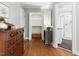 Hallway features hardwood floors, closet, and bathroom at 2804 Barmettler St, Raleigh, NC 27607